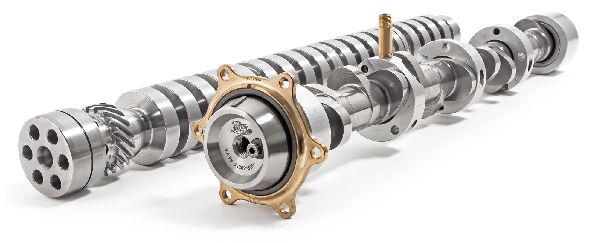 Two Jesel camshaft cores, machined from bar stock, one with a bronze drive flange