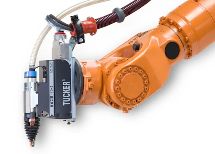 A Tucker TH510 stud-welding head from Stanley Engineered Fastening mounted on an orange industrial robot arm